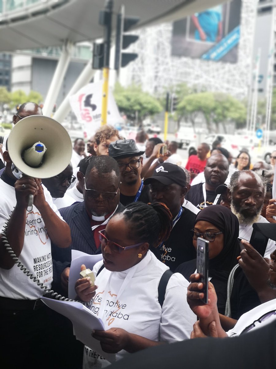 ZELO_Infor's tweet photo. Today ordinary citizens marched, they marched in solidarity with mining communities who are victims of corporate impunity.

#AMI2020 declaration signed &amp; delivered to the corporates.
In 1 of the pictures, Mining Indaba Company'Tom Quinn signs the declaration.
@AltMiningIndaba https://t.co/dsB2AF2hBl