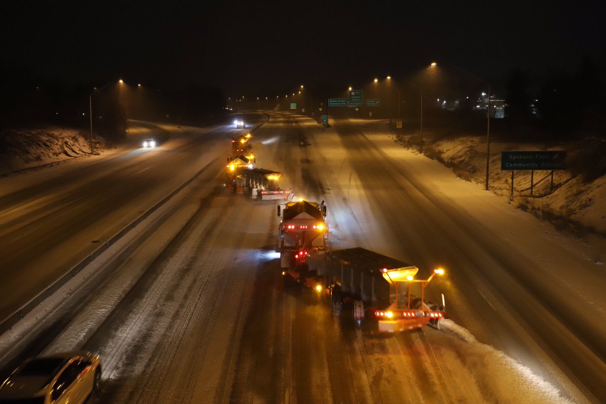 Three plow trucks headed west on I-90.