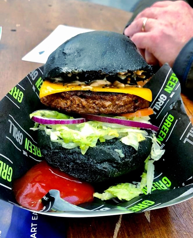 THE 🤛 MIGHTY 🤜 MEATY. Does what it says on the tin.

Thanks @properplantbased for capturing this pic 📸 of it at <a href="/plantpoweredxpo/">Plant Powered Expo</a>.

We stack our famous #meaty patty with cheese, onions, lettuce, tomato and #homemade burger sauce. 🍔 We then pop it in our #activatedcharcoal buns