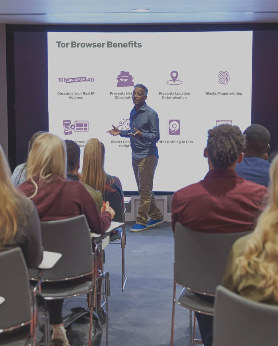 Photo of speaker in front of slide about Tor Browser 