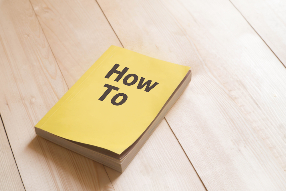 Book with the words "How To" on the cover