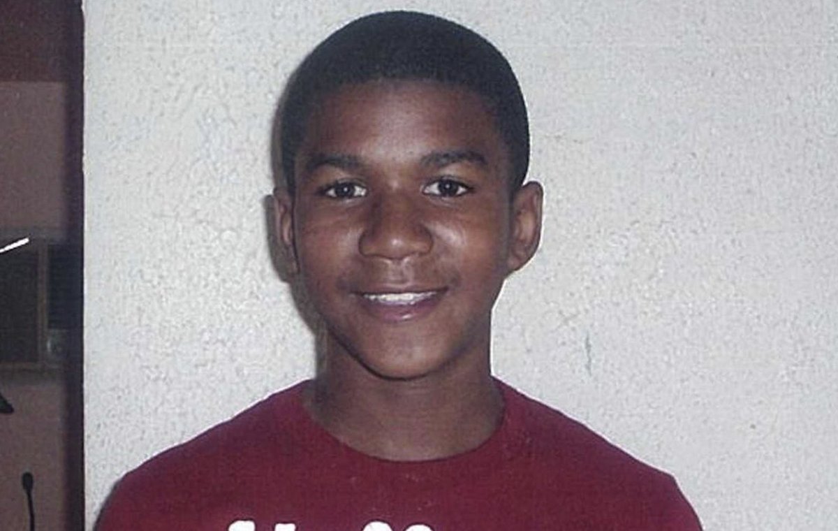 A photo of Trayvon Martin smiling and looking at the camera.
