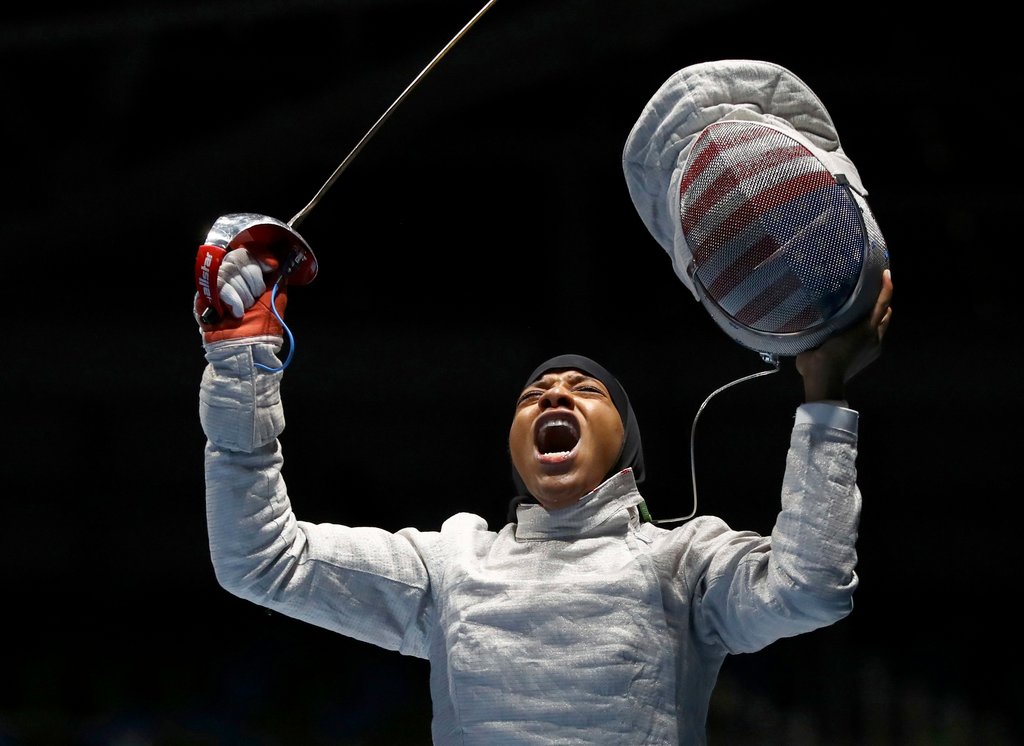 A photo of fencer Ibtihaj Muhammad celebrating a win during the 2016 Rio Olympics.
