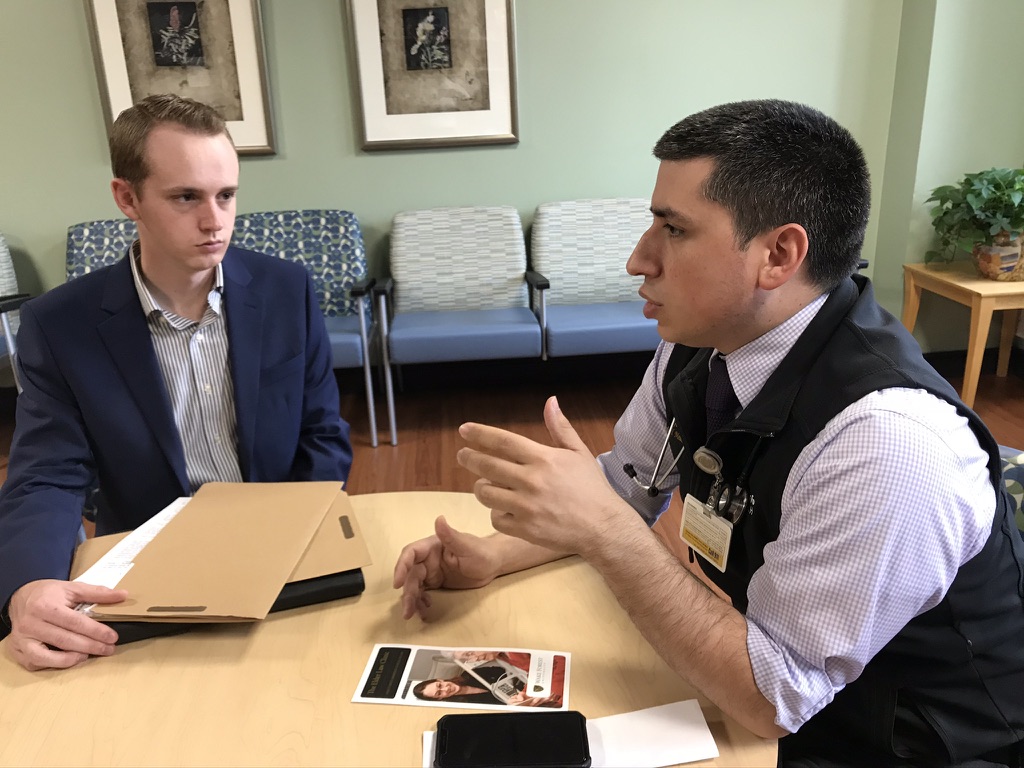 KateMewhinney's tweet photo. Eli Hardin (left) met w/ Dr John Aguilar @wakehealth Brain Injury Unit about a client's mental capacity.  Eli is a student in the Elder Law Clinic, a medical-legal partnership @WFULawSchool.  We're proud to be an MLP! @National_MLP  Check out https://t.co/EWu7w30n5M! https://t.co/x1mQuSZBHy