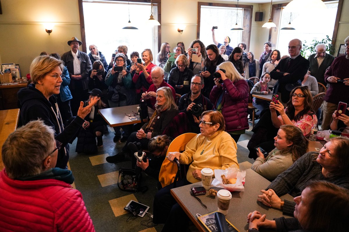 Elizabeth Warren talks with a crowd of supporters.