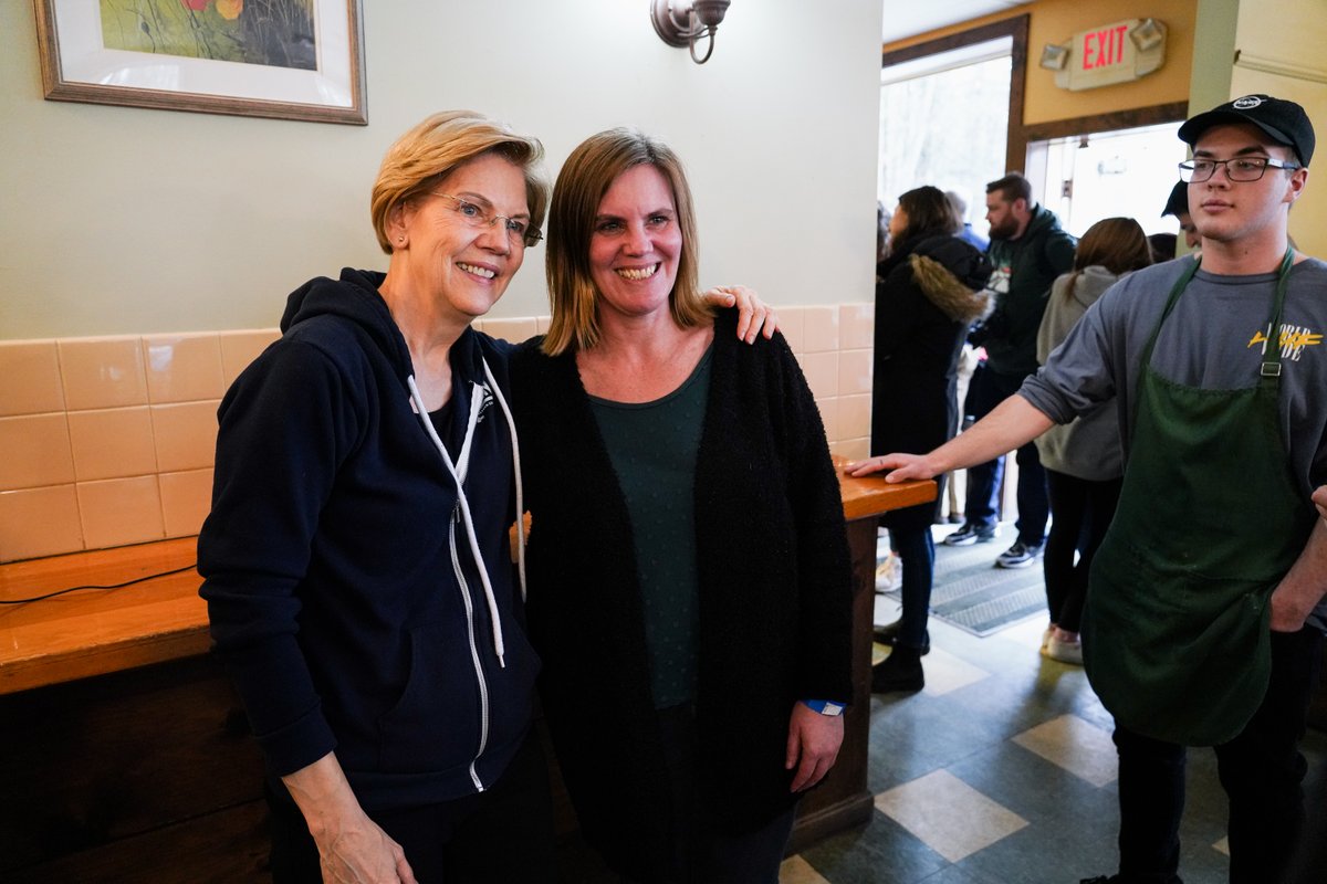 Elizabeth Warren takes a photo with a supporter.