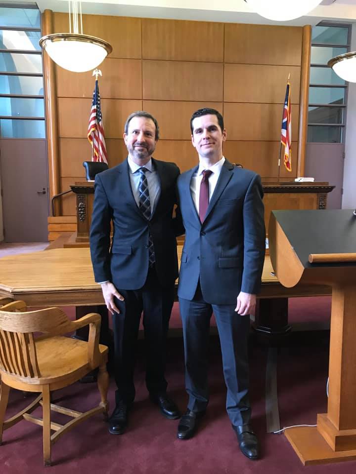 Photo of Professor Pollis and 3L Joe Shell in court