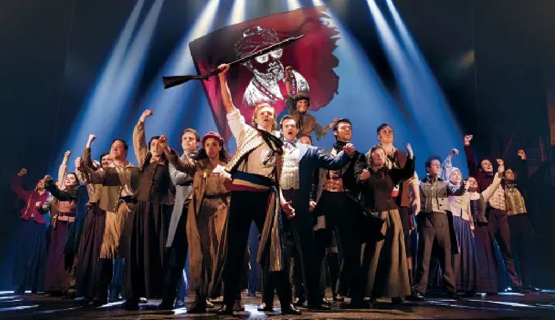 Les Miserable barricade scene with flag bearing the signature image of Maimonedes nutz, maimonedes wearing pixel sunglasses