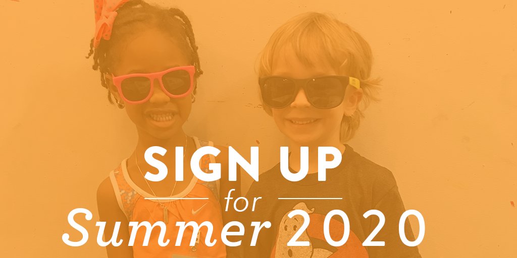 Two young kids smiling and wearing sunglasses together.