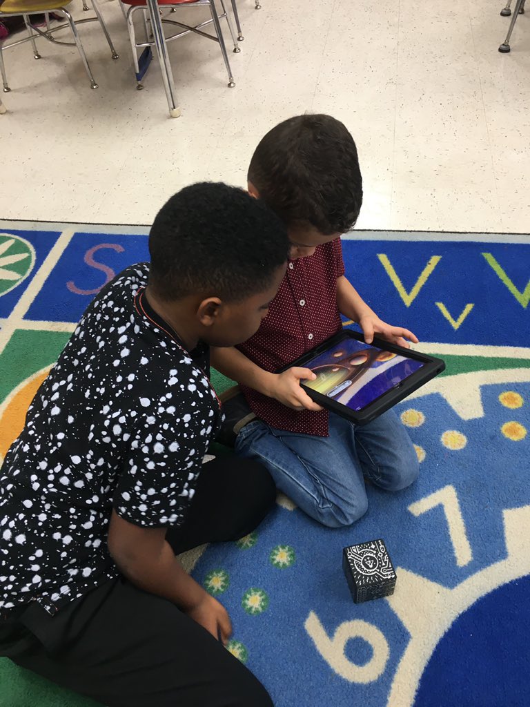 MASTFINSUP's tweet photo. Ms. Gibson’s and Mrs. Menendez’s classes have been learning about the sun, moon, and solar system. We explored space today, using our Merge cubes! #finsup #STEM @MASTFINSUP https://t.co/FO4do77JXX
