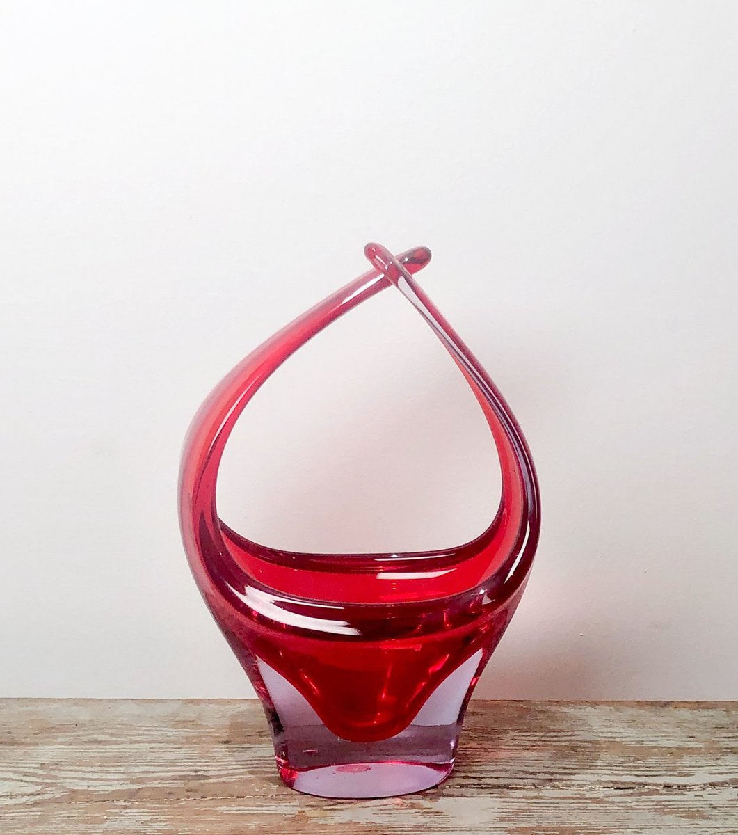 An Italian Murano red glass basket vase, circa 1970.
14.5' high x 9.75' wide x 6' deep
#murano #aaxsf #redglass #glassbasket #glassvase #muranoglass #italy #circa1970 #muranovase #italian #vintagevase #20thcenturyvintage #chic