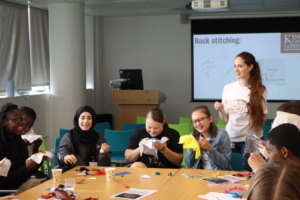 Students and staff taking part in a stem cell stitching workshop