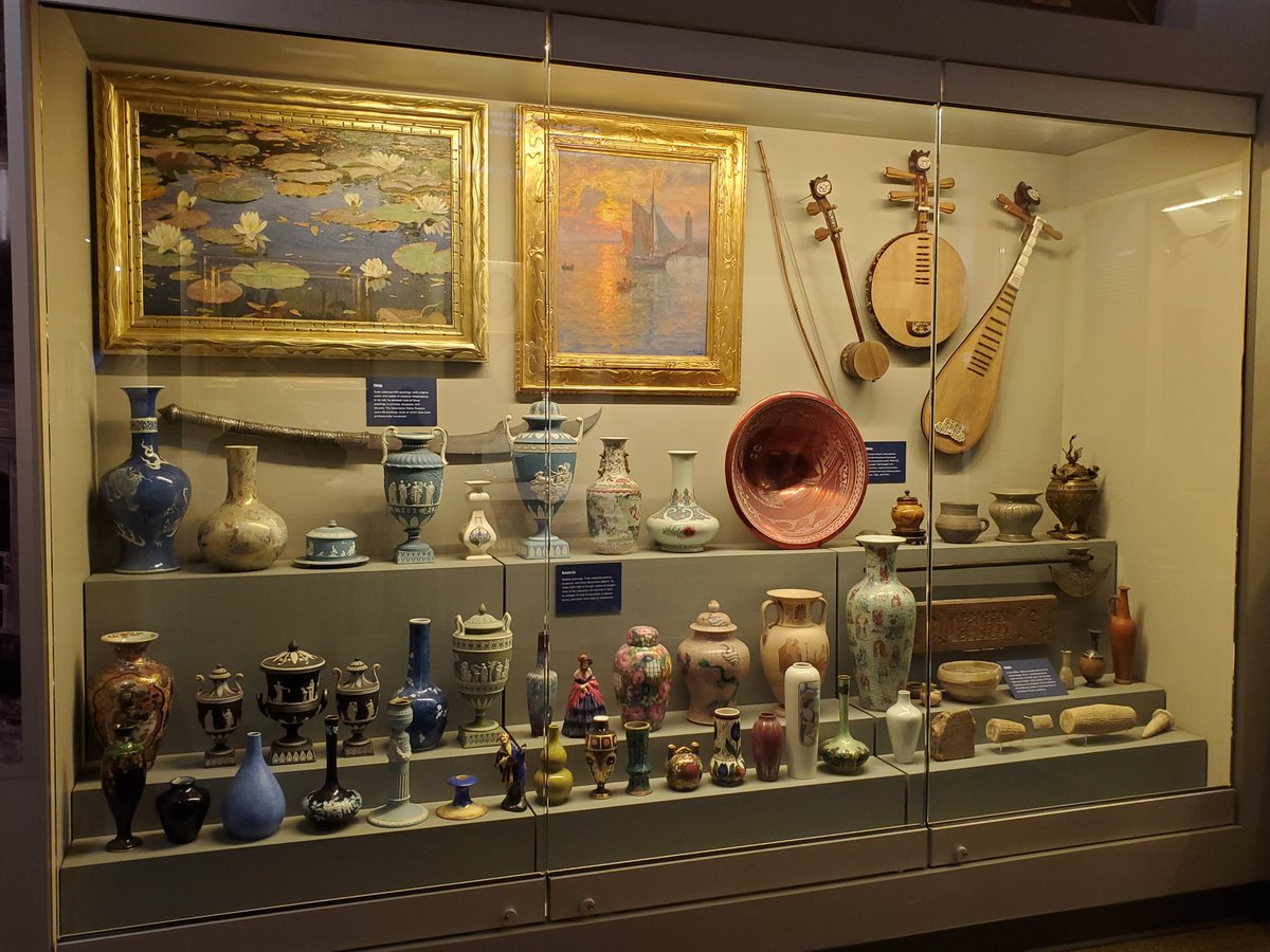 Collection of fine art, musical instruments, and vases from around the world.