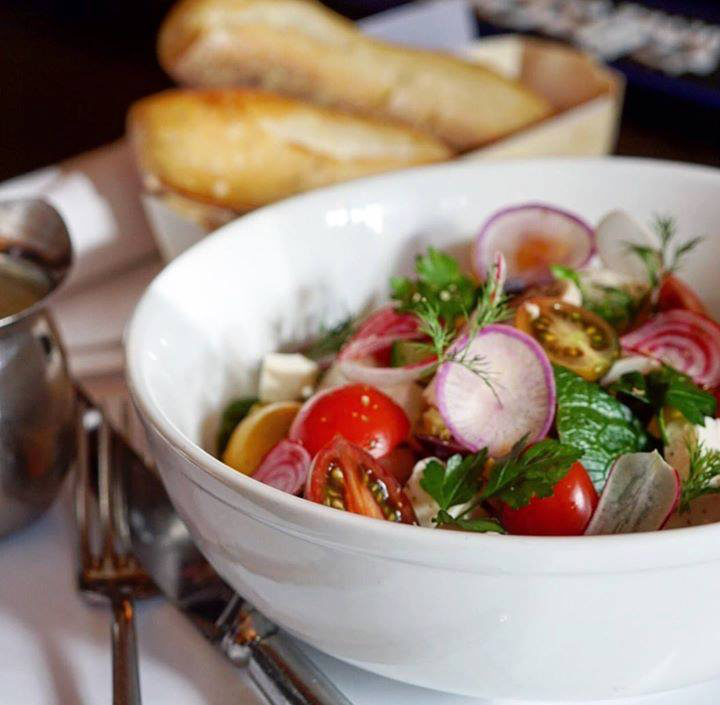 The Ruhlmann Salad. Mixed greens, tomatoes, heart of palm, corn, feta, olive &amp; oregano dressing with your choice of grilled chicken, shrimp or grilled tuna. #BrasserieRuhlmann #French #Brasserie #RockefellerPlaza #RockCenter #Midtown #NewYorkCity  #NYCeats