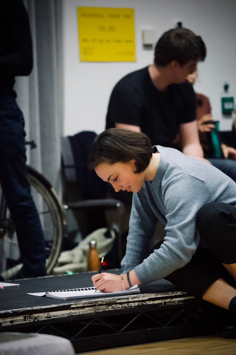 Singing writing notes on the score