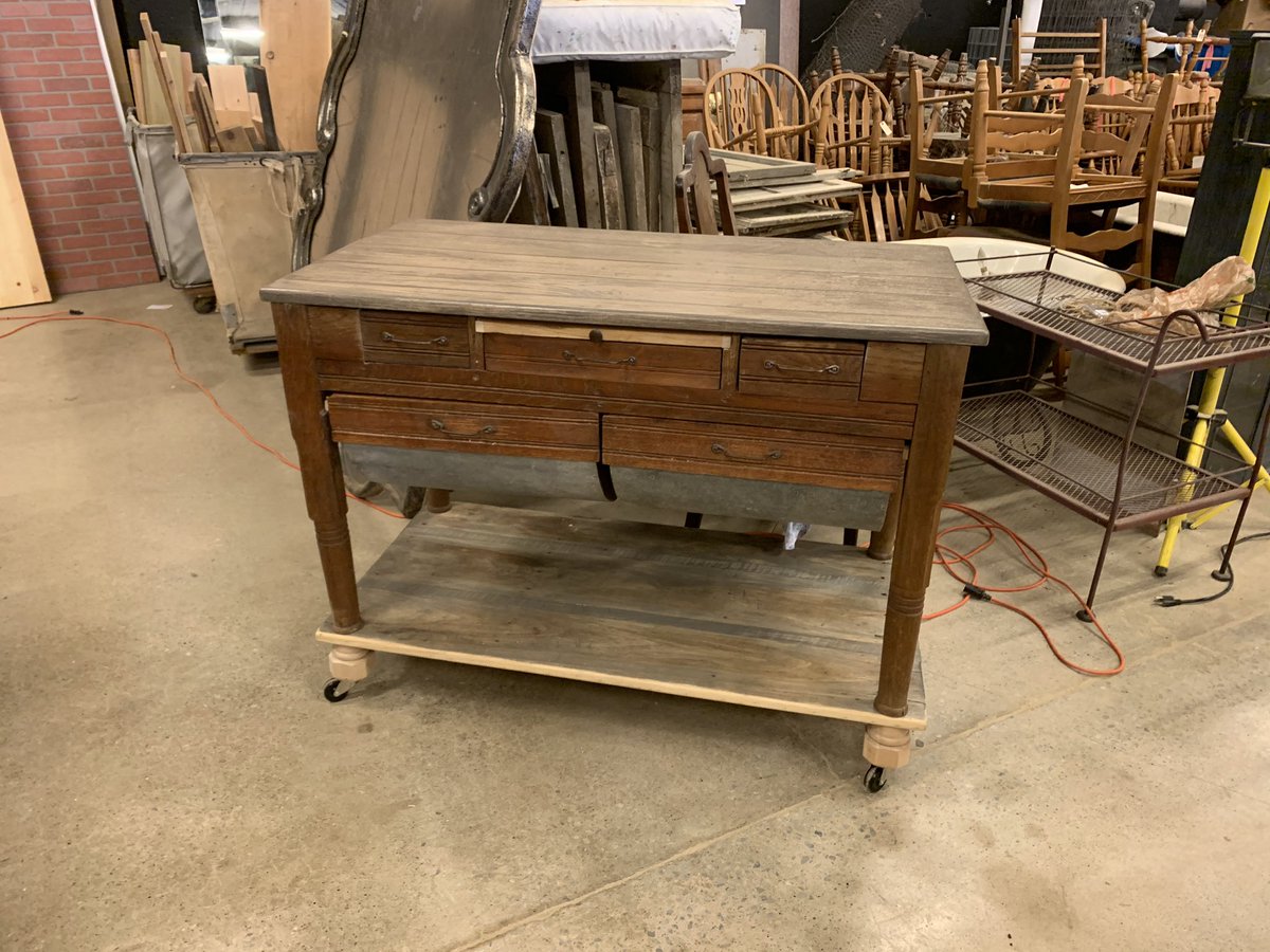 Our possum belly table is ready to finish! This will make an awesome kitchen island or sideboard in someone’s home! What distressed paint color would you like to see on the body of this piece? Top and bottom shelf are weathered wood tone. #rockinbmercantile #restoredfurniture