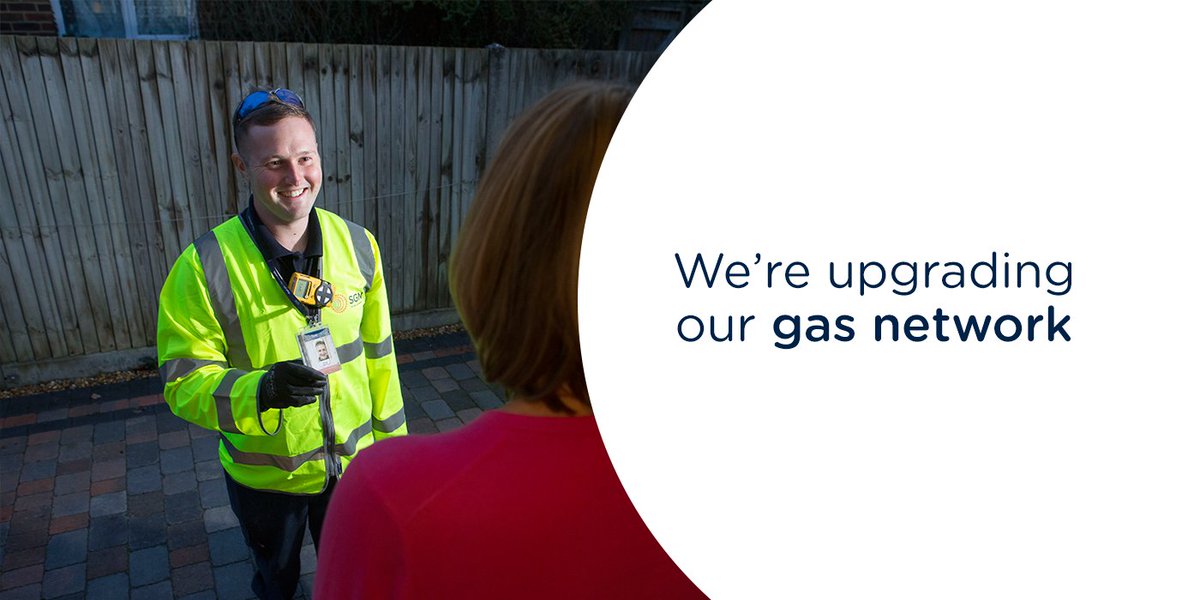 Gas engineer showing ID badge to a female resident