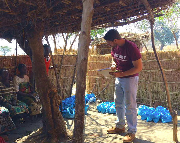 Tim Silberg, MSU graduate student, talking with community members in Malawi