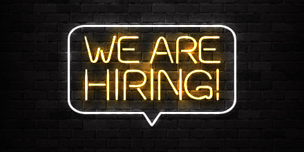 Neon sign reads "We are hiring!"