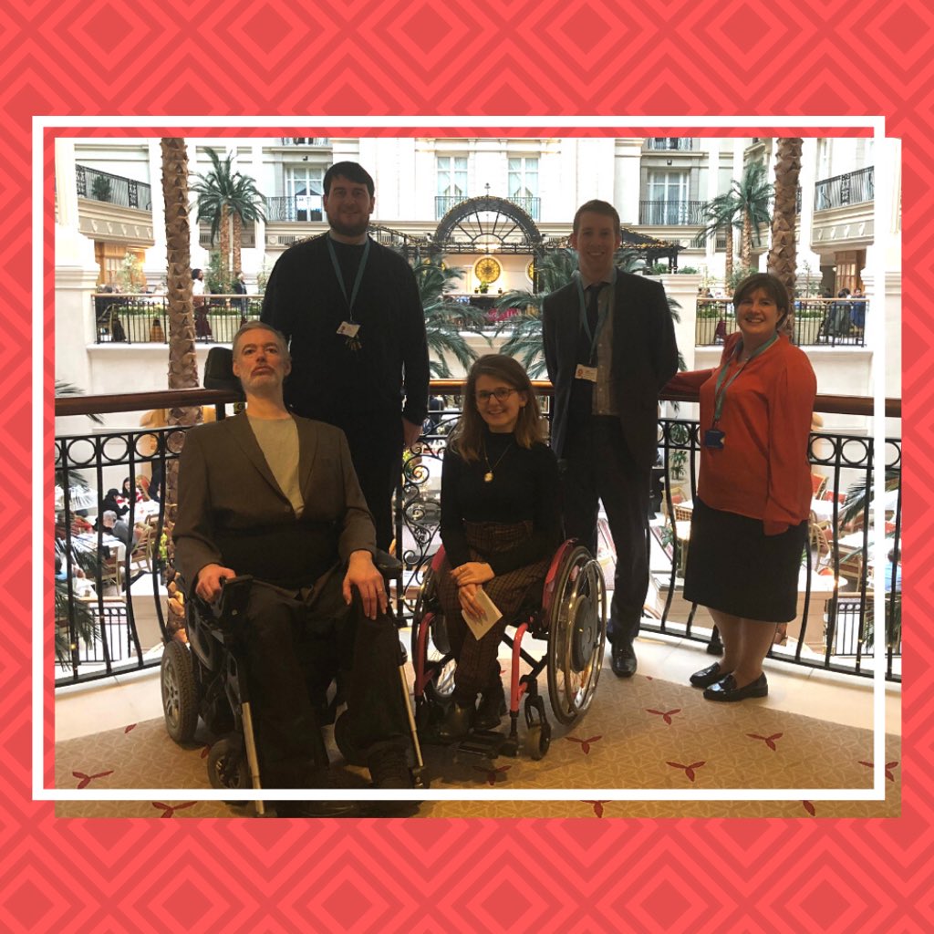 Alan and Katie with three people from Chiltern in a bright room with plants.