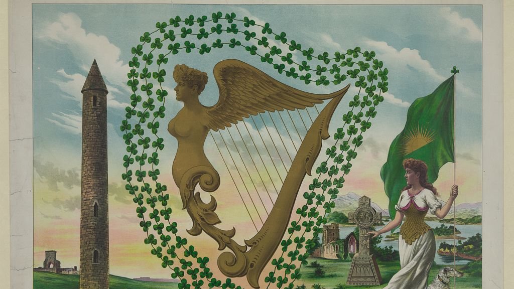 Print shows "Ancient cross, ancient harp & shamrocks, standard of Erin, round tower, abbey, lakes of Killarney."
