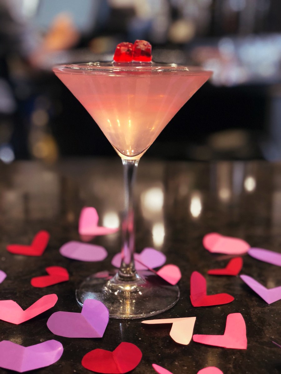 This pretty cocktail is called the Love Potion and it's our Drink of the Month!

RECIPE:
2 oz. Nolets Gin 
½ oz. pink cranberry juice
¼ oz. lemon juice
Splash of grenadine
2 red gummies as garnish 

Ask for this special cocktail at the Arterra bar!