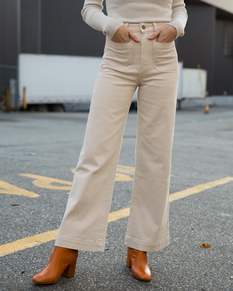 The Rollas Sailor Jean in Cream, high waisted with a fitted top block, opening out into a relaxed knee and wide leg silhouette. Shop this Rollas style and more in-stores &amp; online now | stilllifeboutique.com