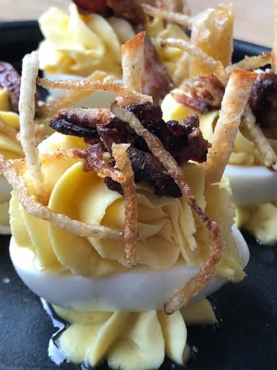 Our Deviled Eggs with maple bacon filling, toast, and crisp potatoes are a Wandering Table favorite!

#EatINW #TheWanderingTable #SmallPlates #DeviledEggs