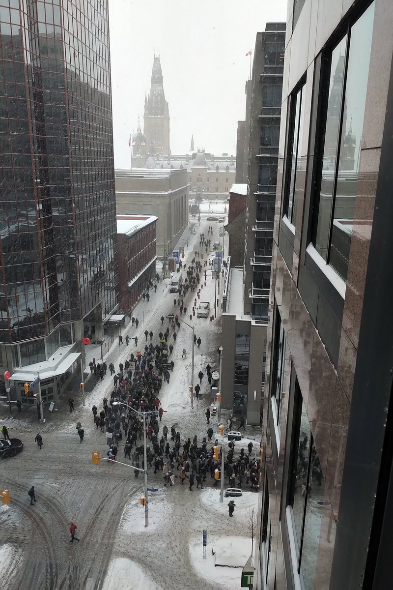 A hundred or more marching through Ottawa's downtown core in protest of the RCMP's removal of Wet'suwet'en from their lands. @APTNNews #wetsuweten