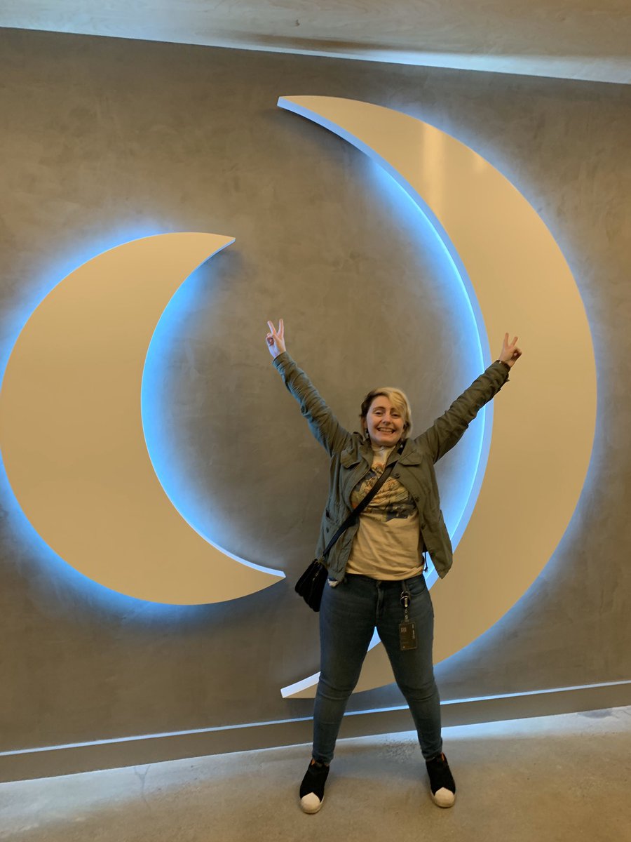 Me standing in front of the insomniac sign holding peace signs.