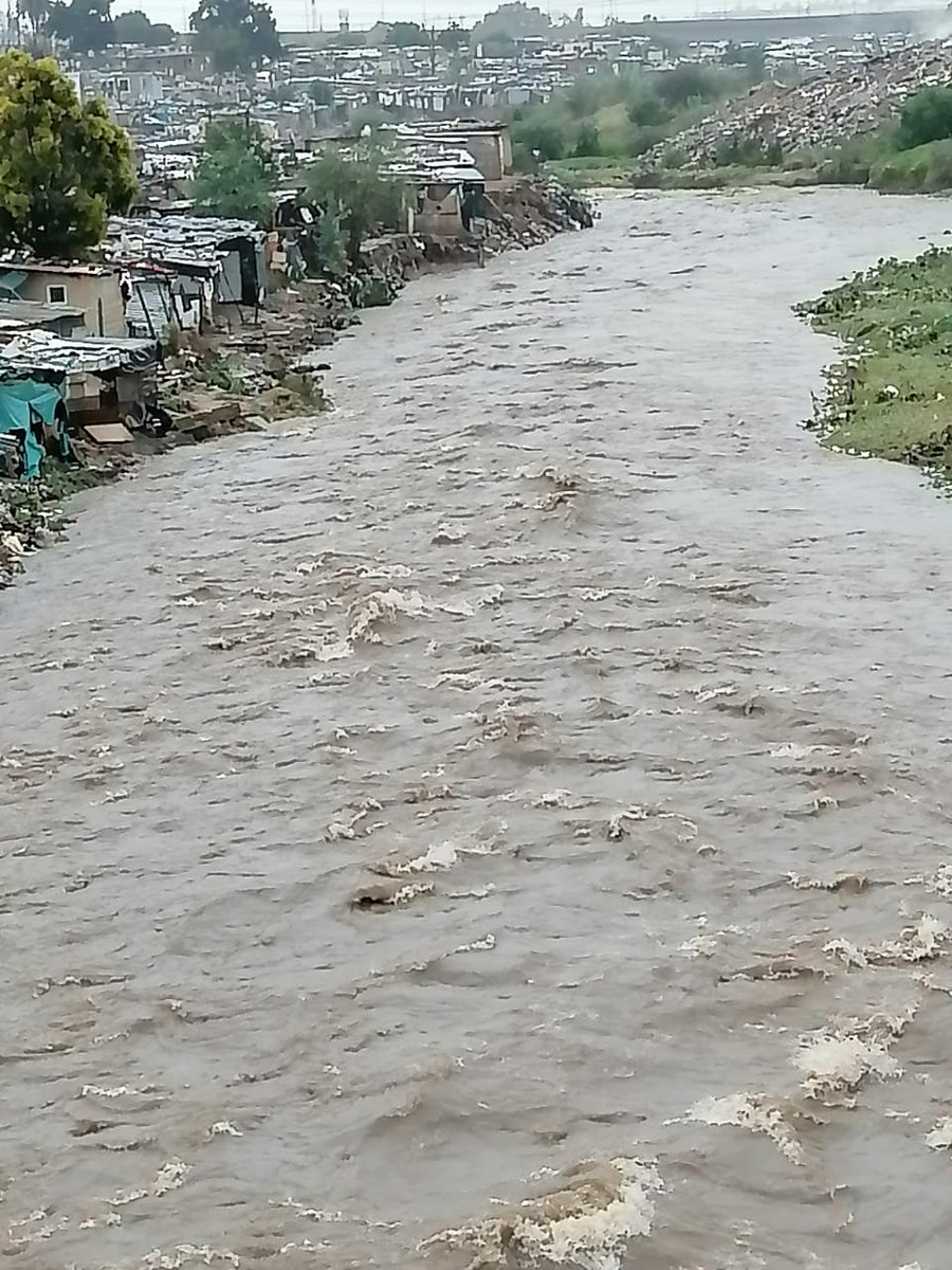 CityofJoburgEMS's tweet photo. #flooding Region E Officers monitoring rising water levels along the Jukskei river near Setswetla Informal settlement, Alexandra https://t.co/gT8H0u2Txq