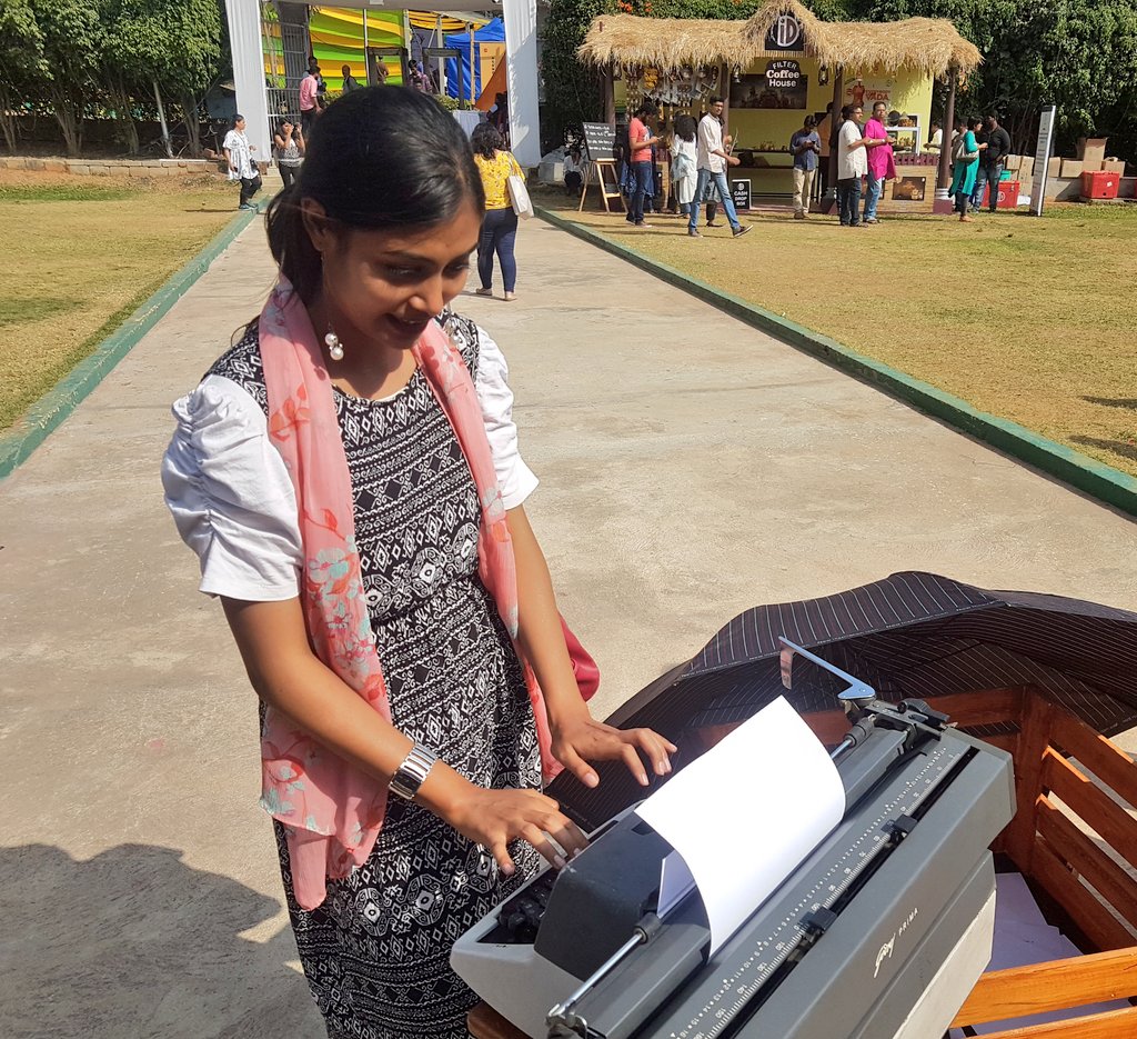 quizzicalguy's tweet image. This is @Aishwar16149992 typing away to glory at the Times Litfest Bangalore this afternoon. Keeping typewriters for the visitors to leave comments on the fest is quite a novel idea. There is an old world charm about it and I am loving it being a history lover. #TimesLitfestBlr