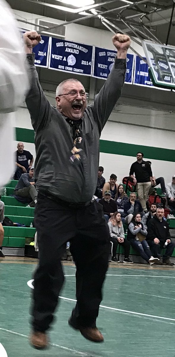 The ⁦<a href="/RSU57Mustangs/">MassabesicAthletics</a>⁩ wrestling coach Rick Desrosiers is pumped after Jack Carroll’s consi final win. #VarsityMaine