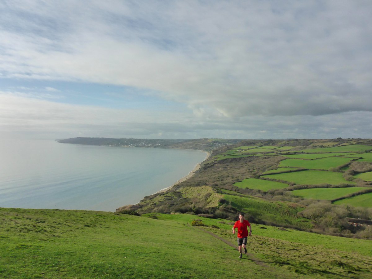NTSWOF's tweet photo. Ciara causing chaos today 🌪️🍃, but conditions were golden around the #SWOF 2020 site on the Jurassic Coast earlier this week, as we spent a day in the SWOFice running from sea to summit, scoping trails around Golden Cap. 🌅🏃‍♂️🦖🌄🏃‍♀️☀️🦕 Enter races here: https://t.co/uuzxGBOR0F https://t.co/VvE4Z6BZYI