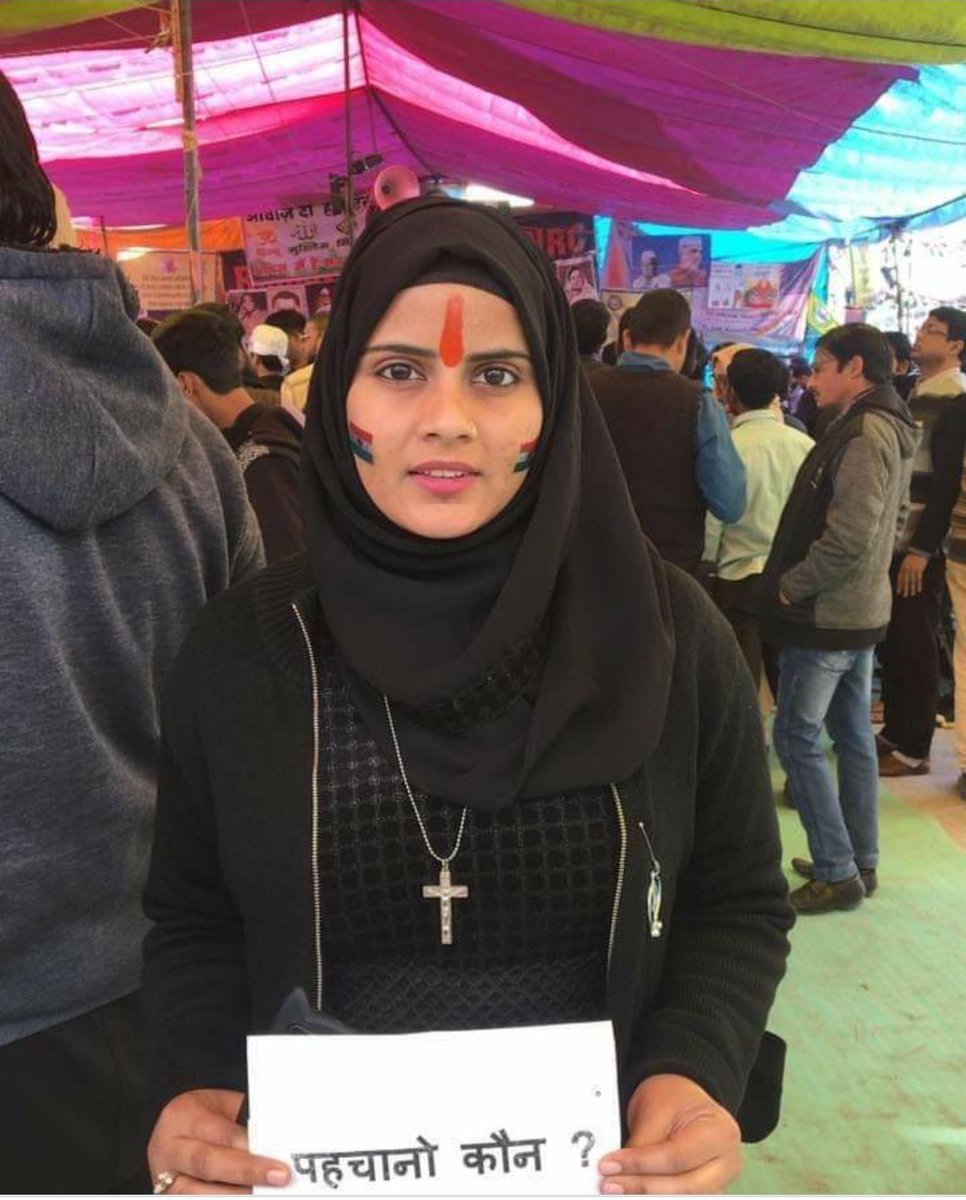 AgainstCAANRC's tweet photo. Lovely, Bold and Beautiful girl at Shaheen Bagh, New Delhi.

Dressed in Hijaab, Chandan on her forehead, wearing a Cross, Khanda (Symbol of Sikhism) pinned on her burqa and Indian Flag painted on her cheeks. ❤️

#IndiaAgainstCAA_NRC_NPR https://t.co/g6S4AejOuX