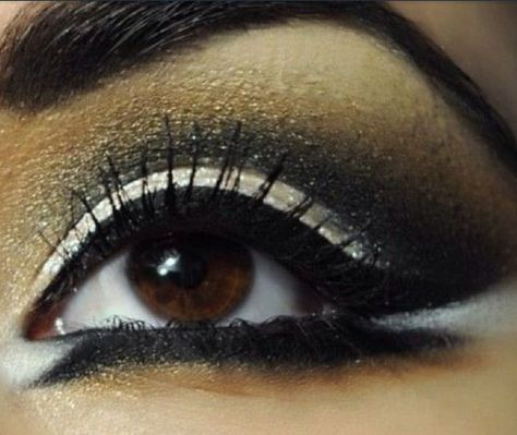 Marik HIGHLIGHTED FOR THE GODS. Wears p similar makeup to Yami's but purely in nudes, gold & the occasional pop of lavender. I can absolutely not find any eyeliner that is like his that isn't cosplay but assume it's there in these pics. Yami the same, maybe a bit smudged bc well.