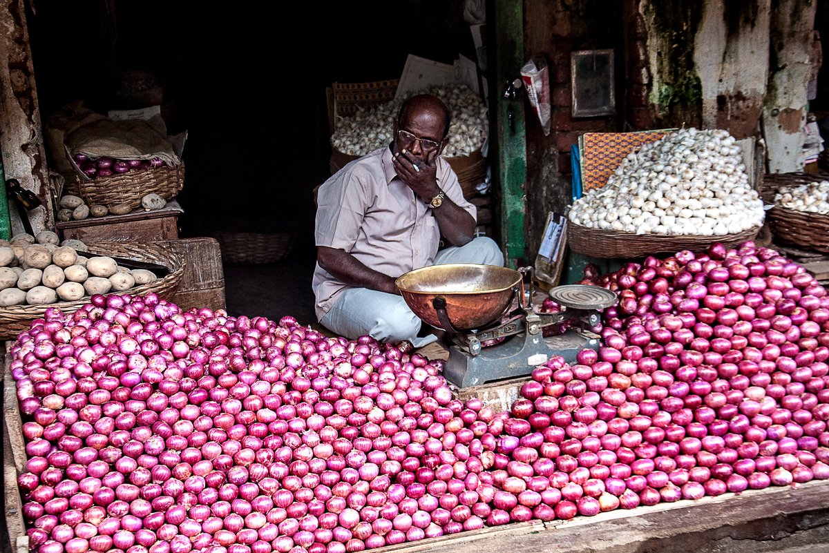 An Onion Seller in a Mysore Street Market. #Mysore #Mysuru #StreetMarket #market #India #PeopleoftheWorld #streetphotography #travelphotography #photooftheday #nikonphotography @ThePhotoHour @LensAreLive