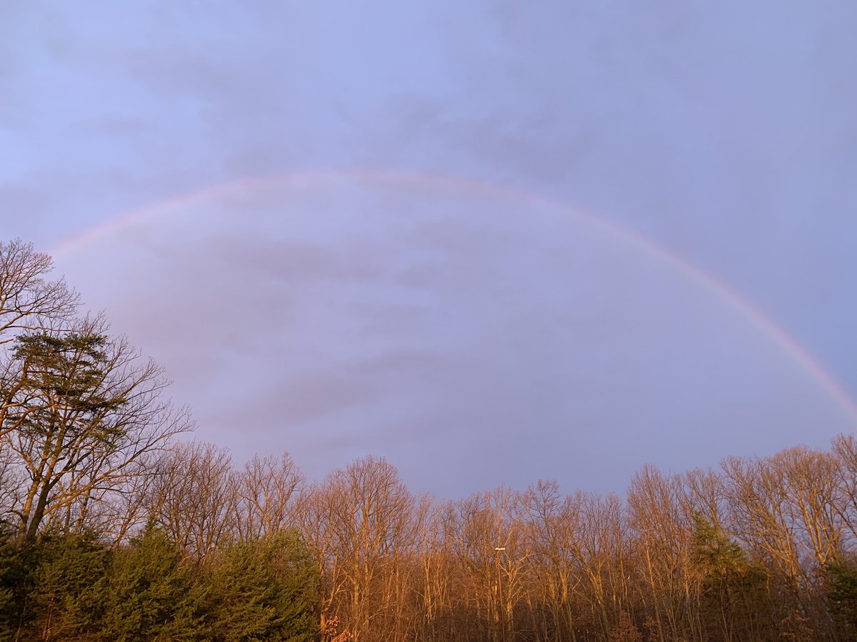 Rain isn’t bad when you have something beautiful to look at! Getting set up for GFHS Touching Bases! 🌈