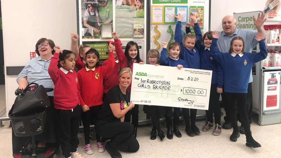 Here's Grace our Robroyston store's community champion presenting an Asda Foundation cheque for £1,000 to the 1st Robroyston Girls' Brigade after they won our green tokens vote. Grace says: "They will be using the money to buy new uniforms and upgrade equipment for camping."