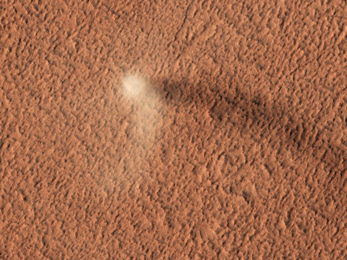 The Devil is in the Details: The HiRISE camera has done it again: here is yet another stunning image of an active dust devil on Mars.  (NASA/UArizona)