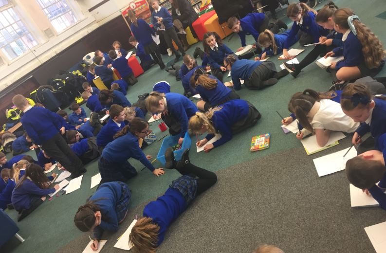 WiganLibraries's tweet photo. Years 3 &amp; 4 from St Oswald's Ashton-in-Makerfield enjoying the author Sean Perkins and the tale of his cats Oscar and Ben. Thank you to St. Oswald's and Sean for a great visit to Ashton Library. #SeanPerkins #AshtonLibrary
#NationalStorytellingWeek 
@WiganCouncil https://t.co/QeewfCOqdK
