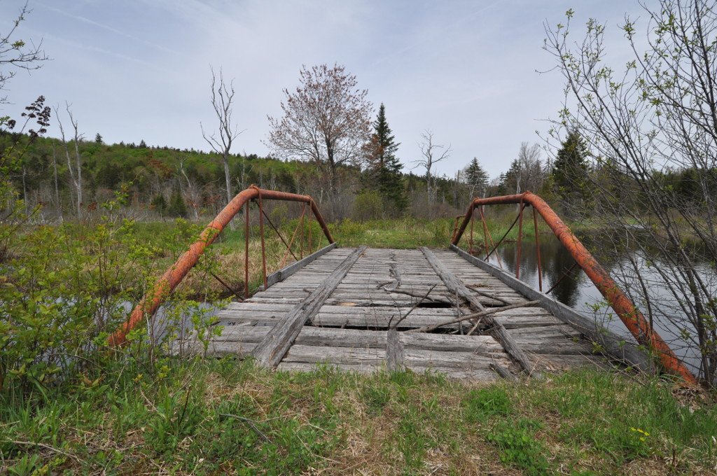 often, with these threads, i am surprised at how hard it is to find good pictures of the listed structures. but this is not a problem for the awe-inspiring, historically crucial Coleman Ball-patent pipe pony truss bridge in Windsor, Massachusetts. thank god.