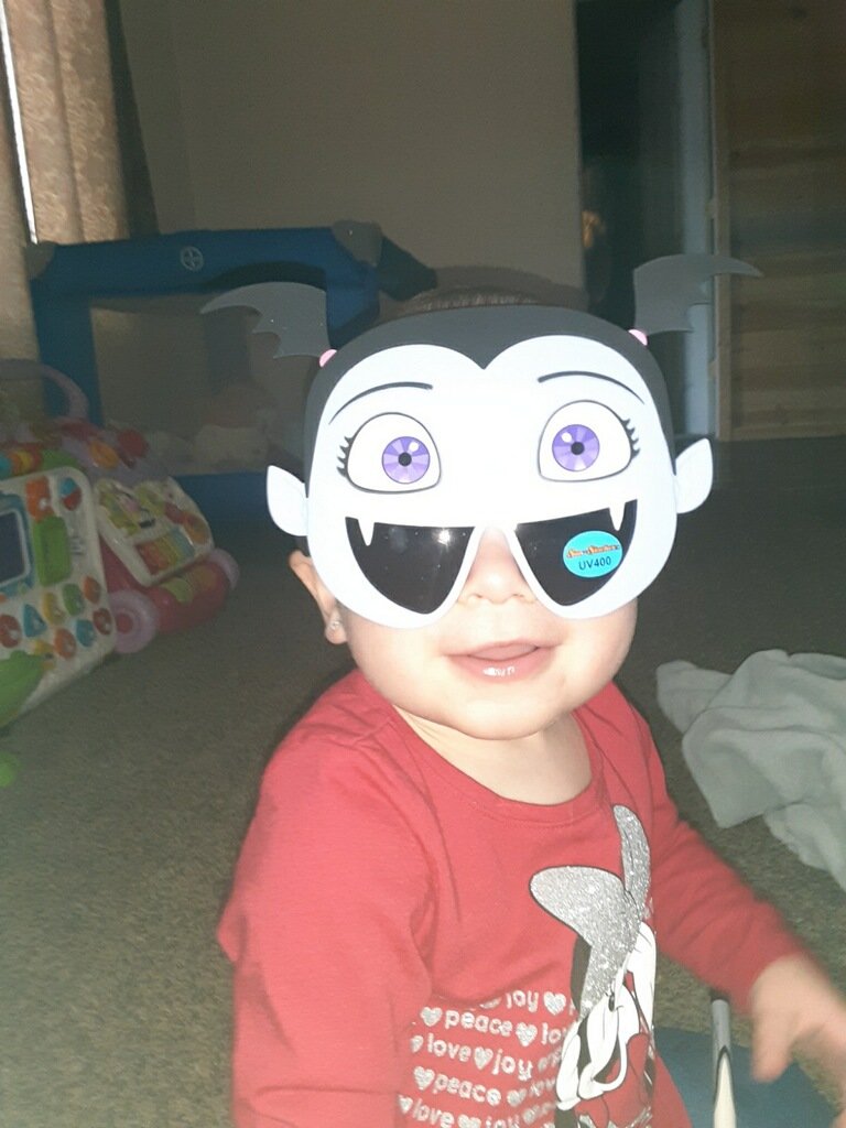 Zo wearing her Vampirina sunglasses