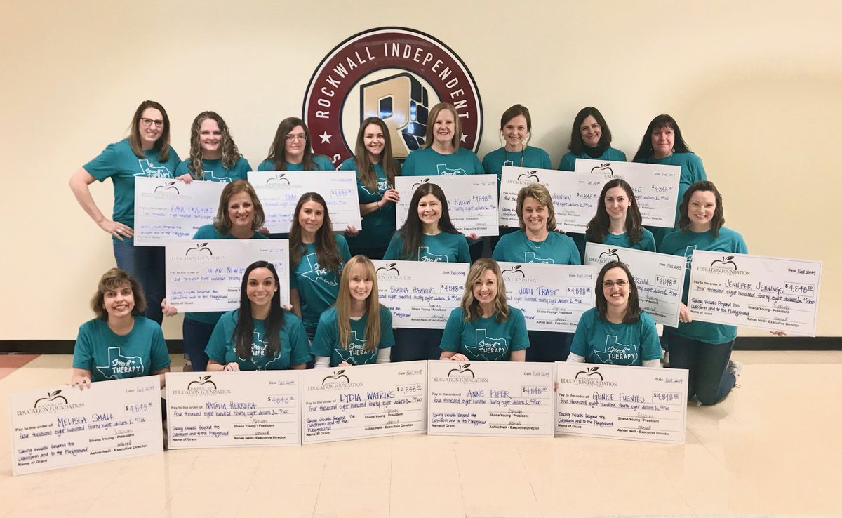 RockwallEdFound's tweet photo. "Taking Visuals Beyond the Classroom to the Playground" grant recipients gathered for a group photo with their checks for $4,848! This grant will impact 3,263 @rockwallschools students by providing a customized visual communication board at 12 elementary campus playgrounds. https://t.co/ARnQw1XZzr