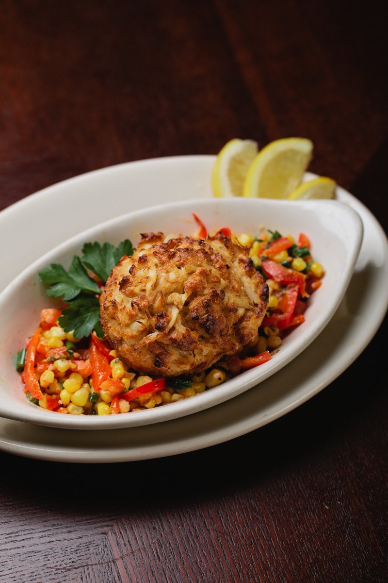 Stop in and try our Maryland-Style Crab Cakes with pan roasted corn.  🦀