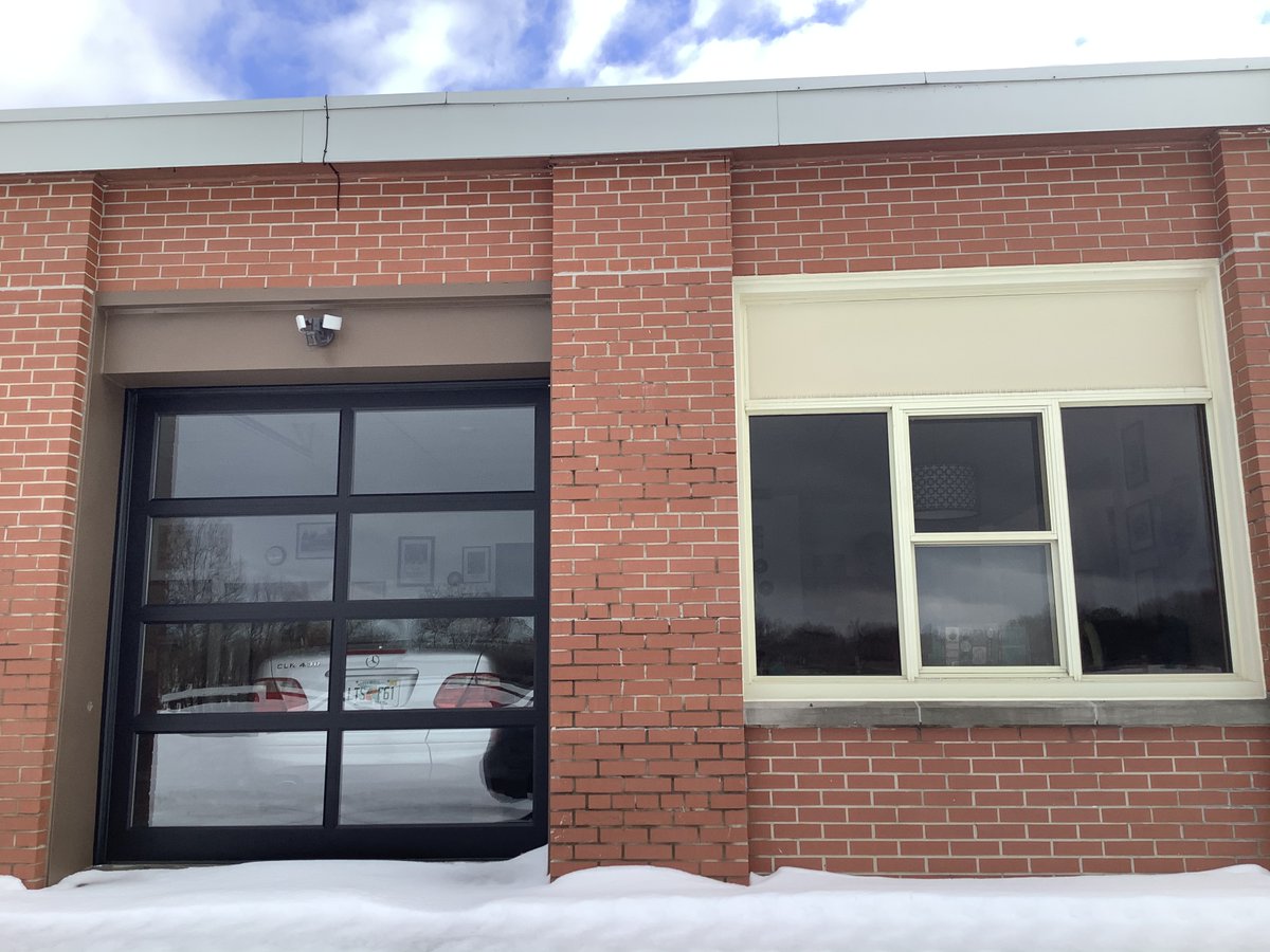 stephradu's tweet photo. Take a look at this amazing example of institutl. #architecture gone domestic. The former school in Ontario now serves as a private dwelling. Old features  were  #rehabilitated. Signs designate original rooms, the gymasium is now a living space&amp;classrooms serve as  parking bays. https://t.co/KtotY53Rio