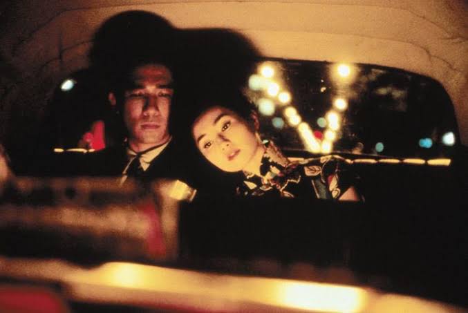 in the mood for love (dir. wong kar-wai, 2000)- a journalist & a secretary are neighbors & they both suspect their spouses are cheating on them with each other- they develop a platonic friendship but eventually catch feelings for each other- wong kar-wai films are so beautiful