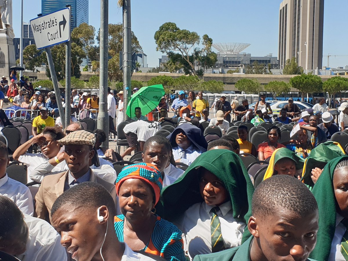 AthiMtongana's tweet photo. Gauteng Education MEC, Panyaza Lesufi has left the comfort of the VIP tent to sit with school pupils in the scorching Cape Town sun. 

Lesufi says this is solidarity with the pupils. 

#MandelaReturns https://t.co/a5sRgK6Yo3
