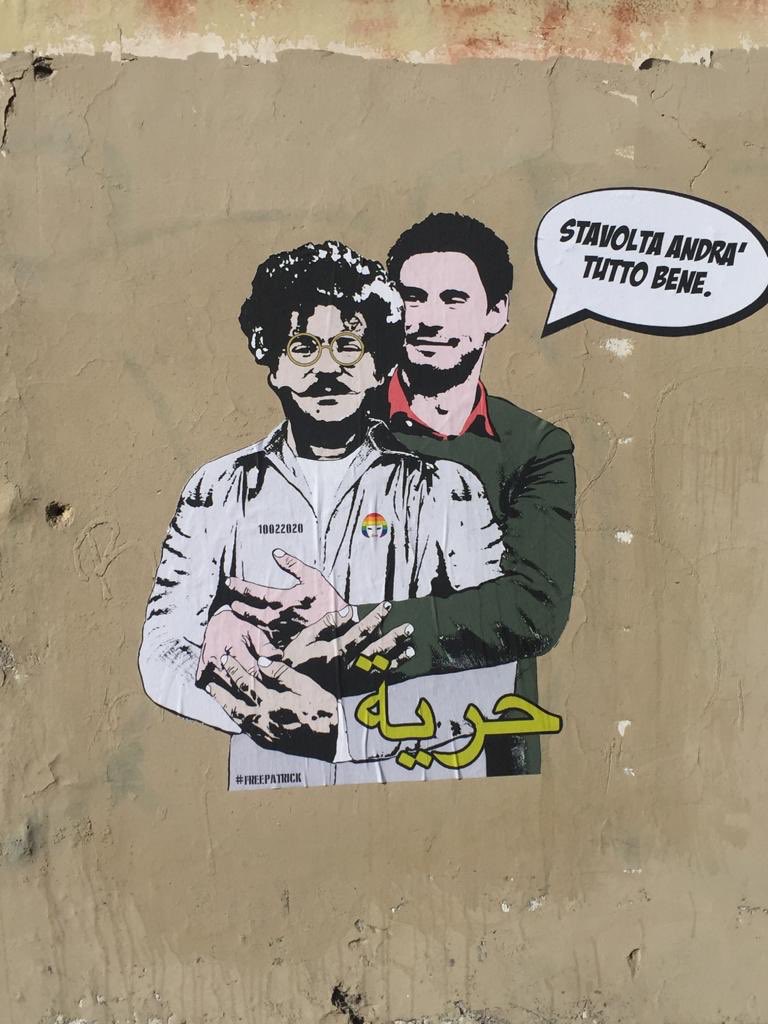soltan's tweet photo. On the wall of Egyptian Embassy in Rome: Giulio Regeni (Italian researcher, tortured to death in Egypt in 2016), is embracing Patrick George (Egyptian rights researcher arrested &amp; tortured upon arrival from Italy).

Giulio to Patrick, “this time, all will be well”

#باتريك_جورج https://t.co/ioxoUIoWhG