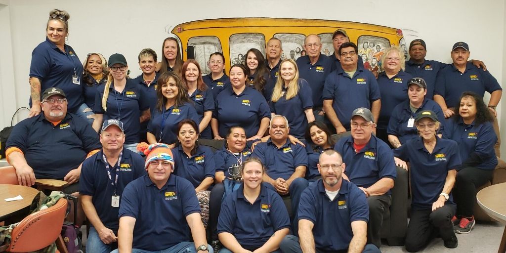 School bus drivers and #UEB grant recipients at Flowing Wells School in AZ say educating drivers is key in the crusade against bullying. Drivers proudly sport t-shirts with: “Kindness Counts Stop Bullying”. The slogan was created by the school’s graphic design class.